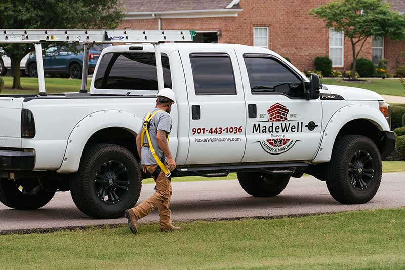 Madewell Masonry technician and company truck arriving at a Memphis home