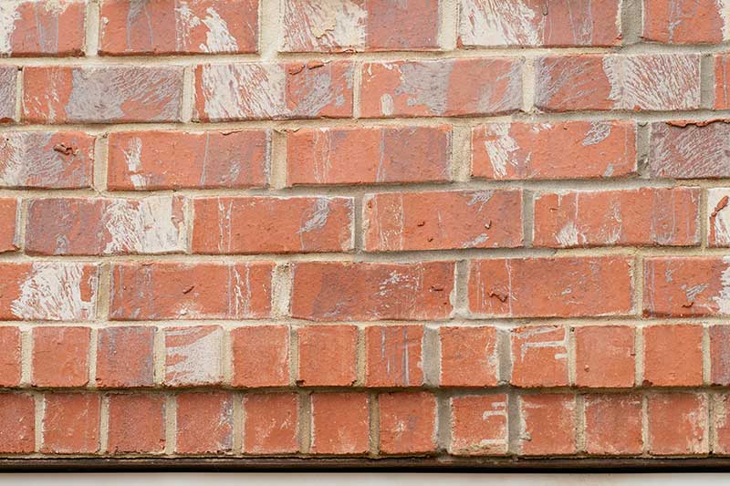 Close up view of freshly smoothed mortar on a brick wall
