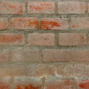 a close up of a masonry wall covered in dust